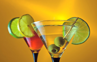 martini with lime and green olives