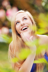 Cheerful girl in a garden