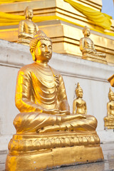 Fototapeta na wymiar Gold buddha in front of gold pagoda
