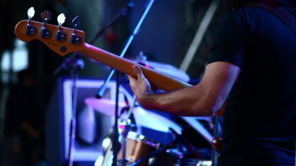 Guitarists in live action at a concert - Powered by Adobe