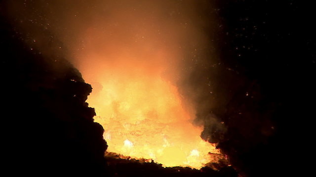 The flow of hot molten metal. Lava