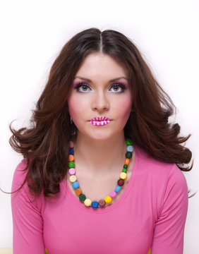 Pretty girl with colored lips and beads