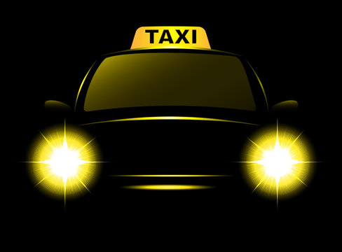 Dark cab silhouette with taxi sign and bright beams