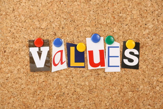 The word values in letters pinned to a cork board