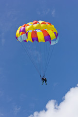 Duo parasailing against clear sky