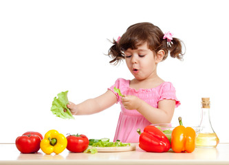 adorable kid girl preparing healthy food