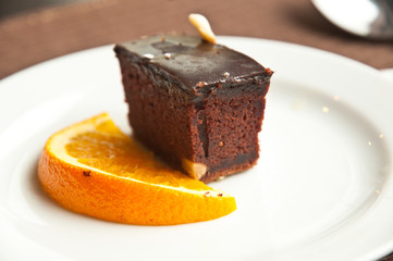 Chocolate cake  and slice of orance