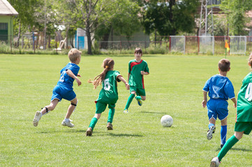 Obraz premium children playing soccer