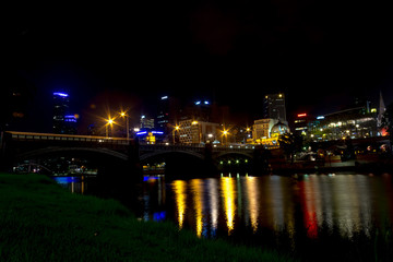 Flinders street bridge over the Yarra River at night