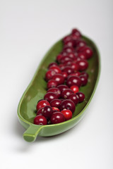 Cranberries in a leaf shape dish.