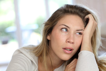 Portrait of blond woman with boring look