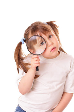 Little girl with a big magnifying glass
