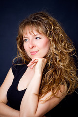 Naklejka premium young woman with long curly hair