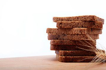 Fresh bread isolated on a wooden table.