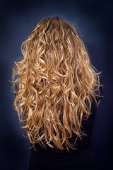 Young attractive woman with long curly hair