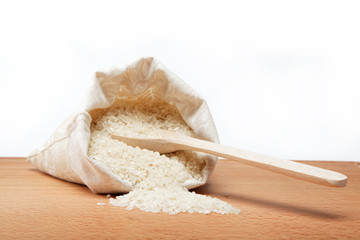 Rice on a wooden table.