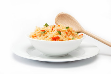 Rice in a bowl on a white background.