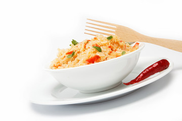 Rice in a bowl on a white background.