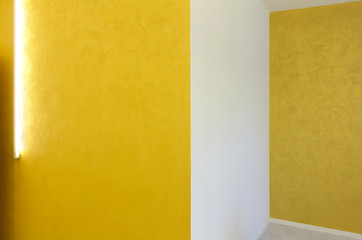 empty room with yellow walls and neon