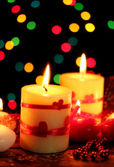 Obraz na płótnie Canvas Beautiful candles on wooden table on bright background