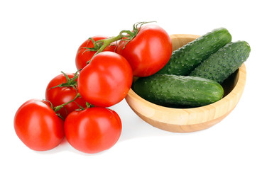 Tomatoes and cucumbers isolated on white