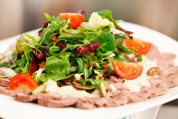 roasted meat with salad