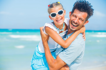 Fototapeta premium Father and daughter having fun on beach
