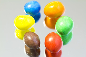Colored chocolates on the mirror