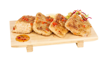 Fried fish fillets with  salad.