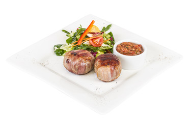 Grilled steak wrapped in bacon, with grilled vegetables, mashed