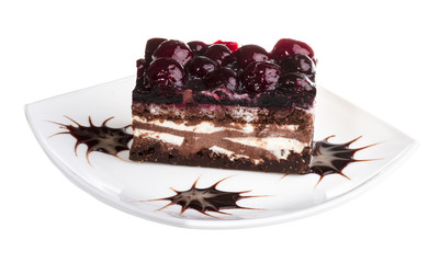 Chocolate cake with cherry on top on a white background