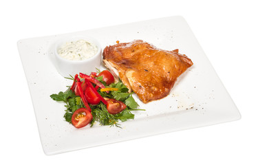roasted chicken with vegetables on a white plate