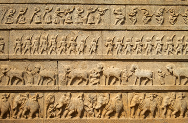 carving on ancient wall in hapi, india