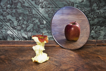surrealistic picture of an apple reflecting in the mirror - obrazy, fototapety, plakaty