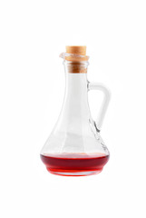 Jug with some red wine, isolated on white background