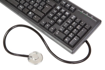 A stethoscope is connected to the keyboard. On a white backgroun