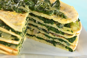 Fresh homemade savory crepes layered with chard