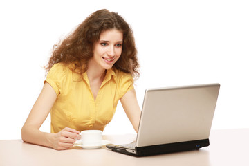 A young beautiful woman working on a laptop