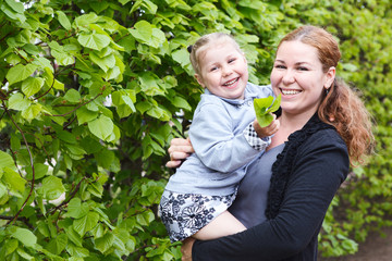Obraz premium Happy mother and little daughter together laughing. Copyspace