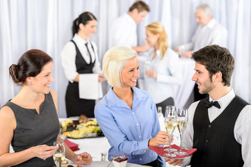 Business woman take aperitif from waiter