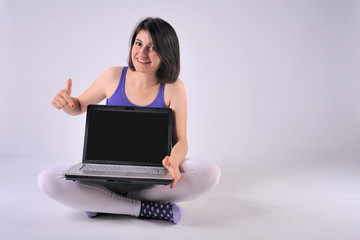 Beautiful girl with notebook computer and surprise