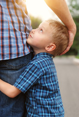 Son hugging his father