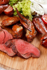 sausages on a wooden cutting board