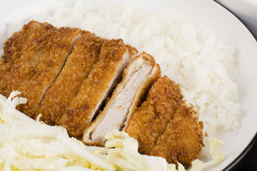 Tonkatsu served with shredded cabbage and steamed rice.