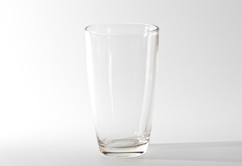 Glass with water on white background