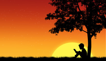 Obraz na płótnie Canvas Silhouettes of children read book under tree