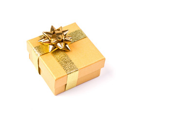 Golden gift box with golden ribbon