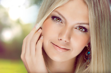 Portrait of  beautiful young  woman with blonde hair close-up - obrazy, fototapety, plakaty