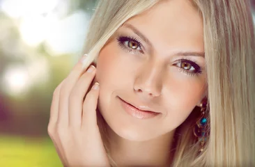 Foto op Aluminium Portrait of  beautiful young  woman with blonde hair close-up © gugelleonid