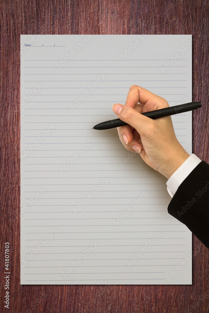 Poster hand writing in open paper on table